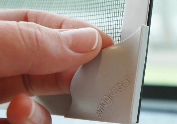 A finished magnetic fly screen installed on a window.